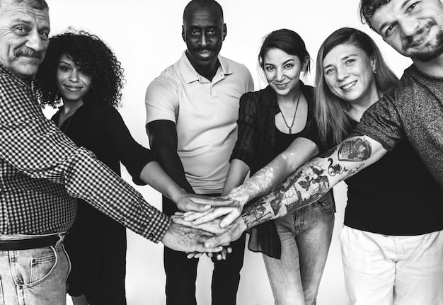 A group of people from diverse backgrounds working collaboratively, symbolizing unity and social cohesion within a community.