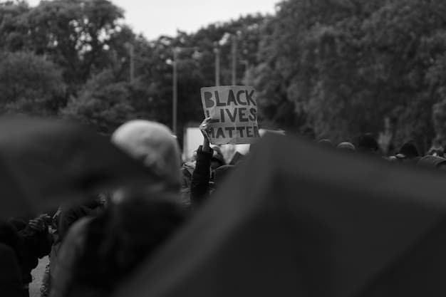 A black-and-white image of a Vietnam War protest in Washington D.C. in the 1970s, with protesters holding signs expressing anti-war sentiments and demanding peace. The image should highlight the scale and intensity of the protests.