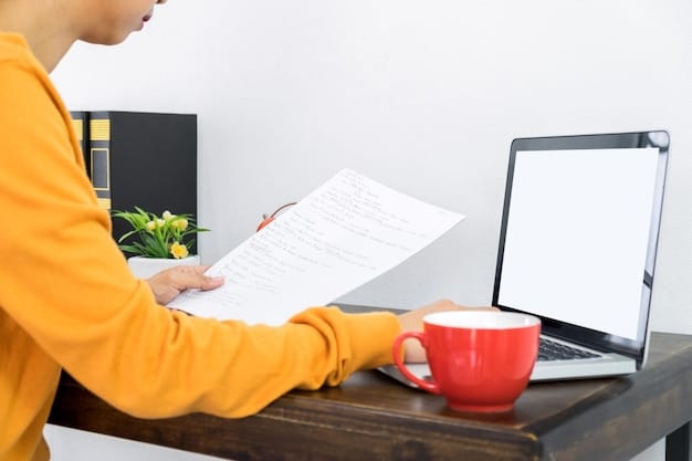 A person filling out a Freedom of Information Act (FOIA) request form on a desk, with a laptop showing the official FOIA website in the background.