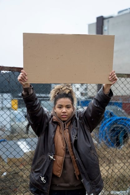 A historical photograph showing protestors marching during the Civil Rights Movement, with signs advocating for racial equality and an end to segregation.