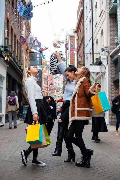 A bustling shopping street in a modern city, with people carrying shopping bags, symbolizing active consumer spending.